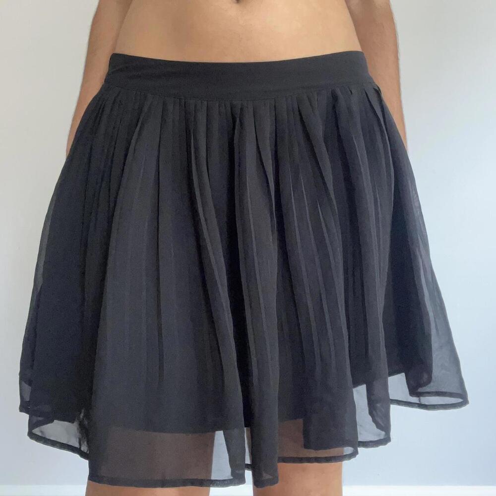 Black mini skirt with mesh overlay, elastic waistband